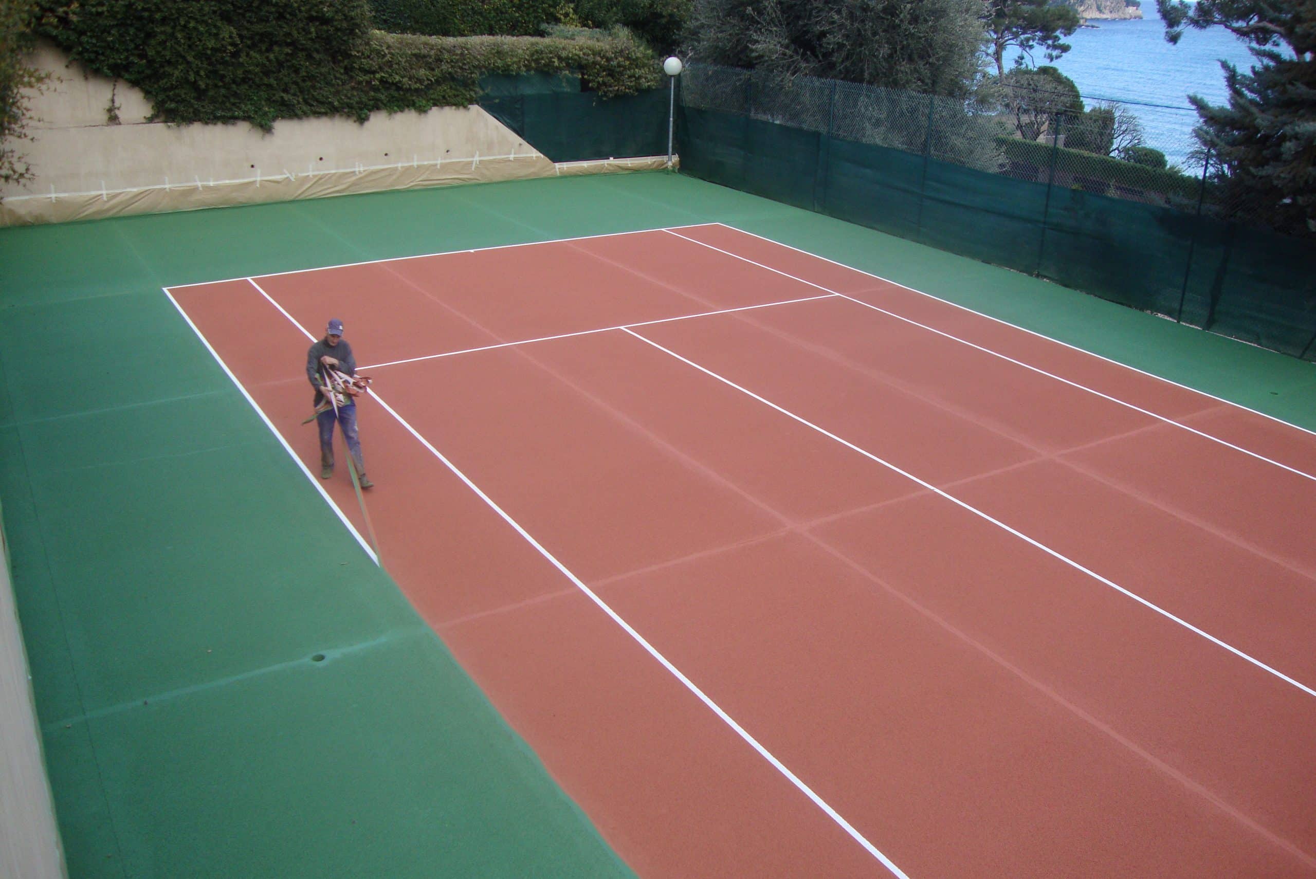 Construction terrain de tennis béton poreux